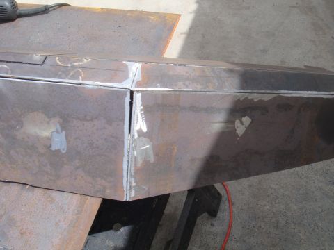 1992 Ford Bronco - Close-up of a custom metal bumper under construction, showing welding and fabrication details.