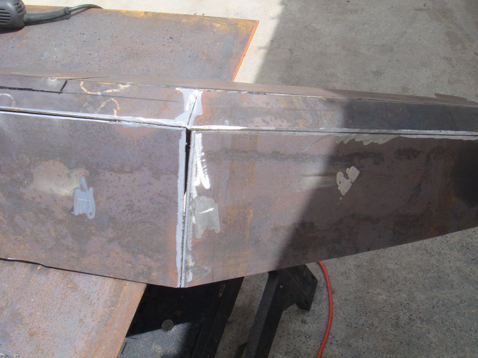 Welding seams on a custom metal bumper being fabricated