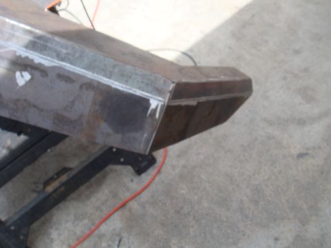 1992 Ford Bronco - A fabricated steel bumper section is shown on a stand, indicating custom work.