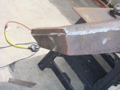 1992 Ford Bronco - A custom-fabricated steel bumper section is shown during construction, resting on sawhorses.