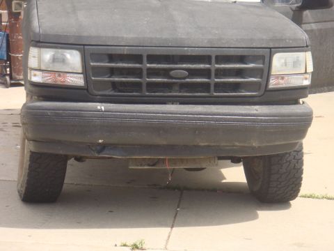 1992 Ford Bronco - Front view of a 1992 Ford Bronco, showing its grille and bumper.