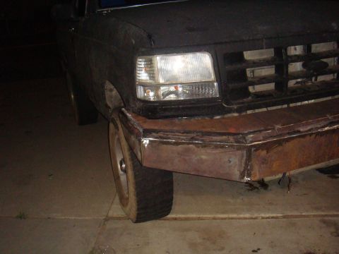 1992 Ford Bronco - Custom metal bumper fitted to a 1992 Ford Bronco, showing the front grille and headlight assembly.