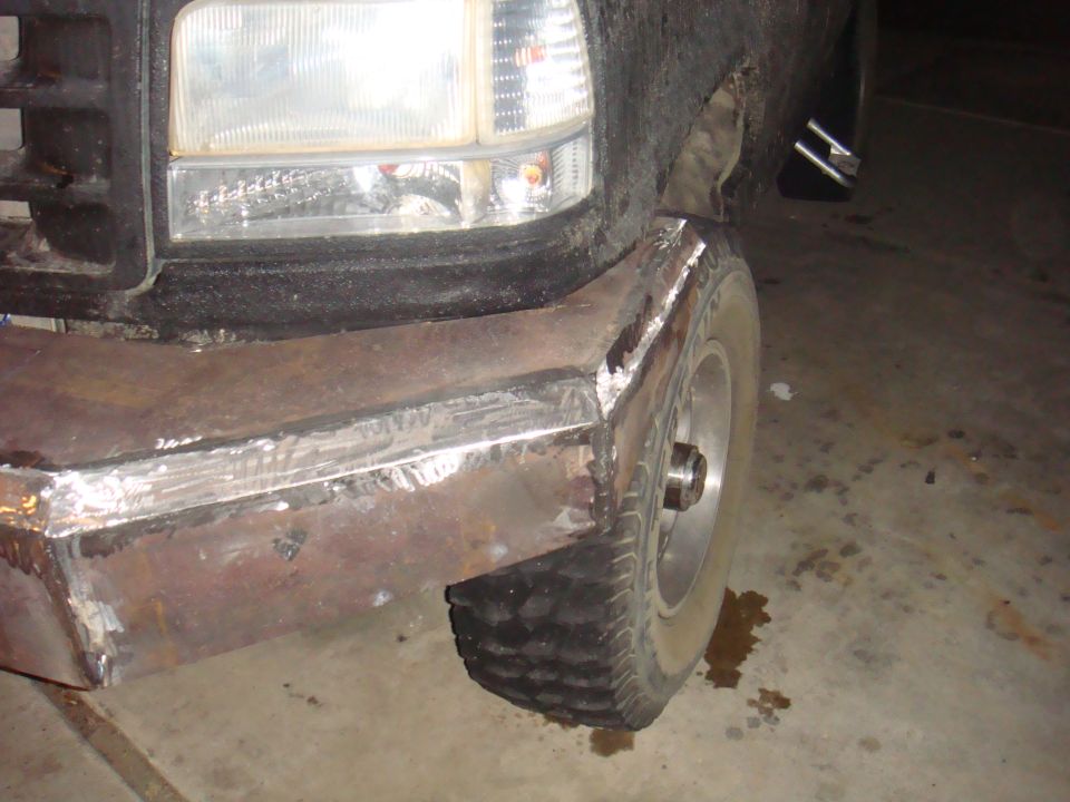 1992 Ford Bronco front corner with custom welded steel bumper and tire