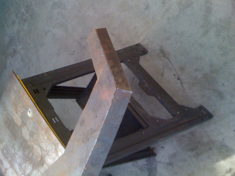 Metal frame part on concrete floor