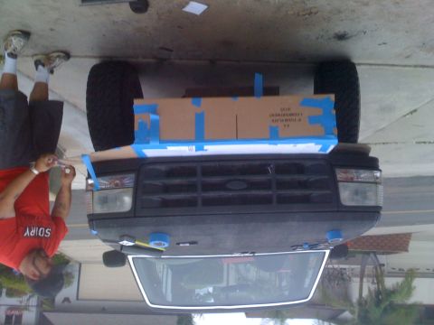 1992 Ford Bronco - Front view of a 1992 Ford Bronco with a cardboard template taped to the grille area.