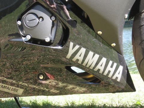 2008 Yamaha R1 - A close-up view of the side fairing on a Yamaha motorcycle, showing branding and engine details.