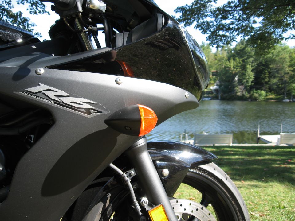 Black Yamaha R6 motorcycle front quarter view with 'R6' badge visible
