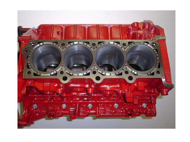 red engine block with four cylinders visible