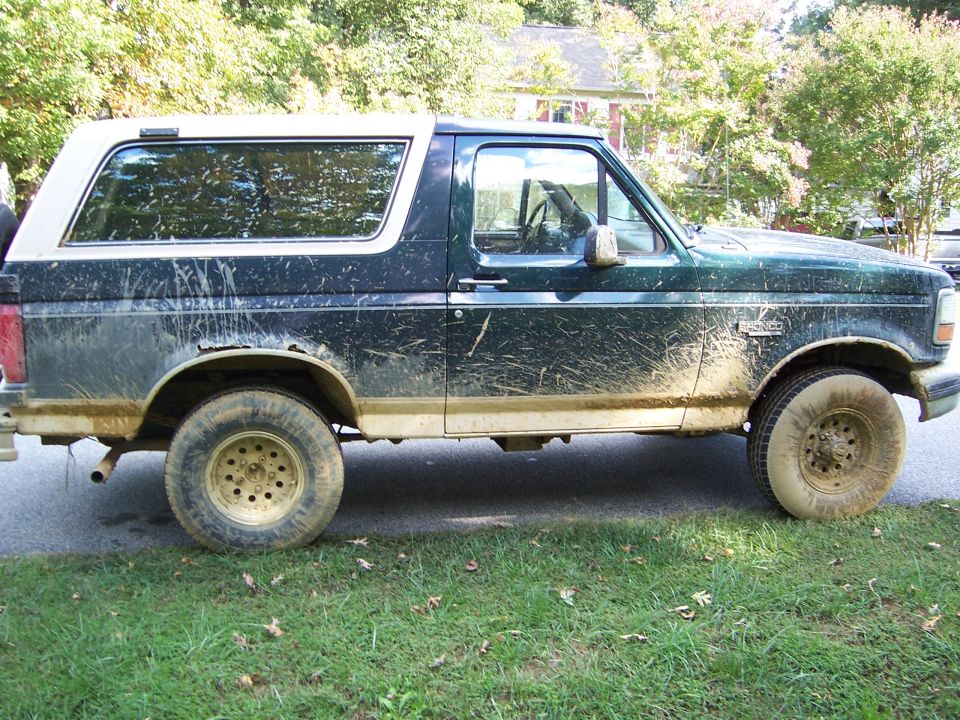 1992 Ford Bronco side view, covered in mud