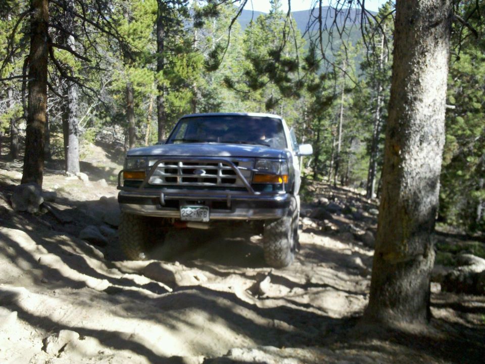 1996 Ford Bronco on rocky trail