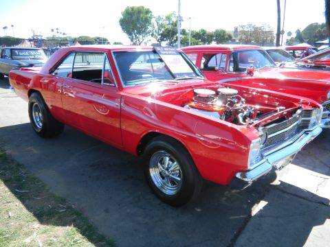1997 Ford Ranger - A red 1967 Dodge Dart GTS coupe with its hood open, displaying the engine and dual carburetors.