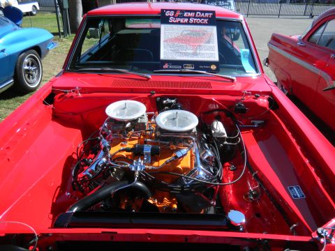 1997 Ford Ranger - A detailed view of the engine bay of a classic 1968 Dodge Hemi Dart Super Stock at a car show.