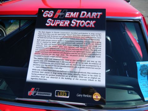 1997 Ford Ranger - A sign detailing the 1968 Hemi Dart Super Stock is displayed on a red vehicle.