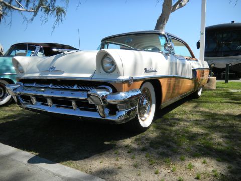 1997 Ford Ranger - This two-tone 1955 Mercury Montclair features distinctive wood paneling and whitewall tires, seen at a cruise event.