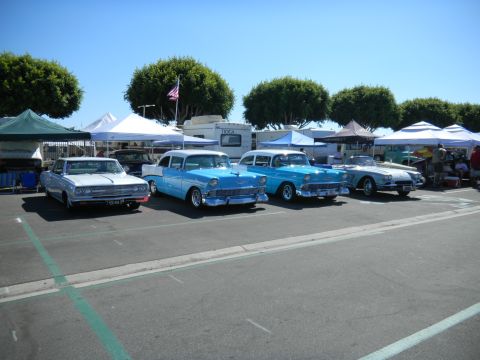 1997 Ford Ranger - A collection of vintage automobiles are displayed outdoors, possibly at a car show or cruise event.