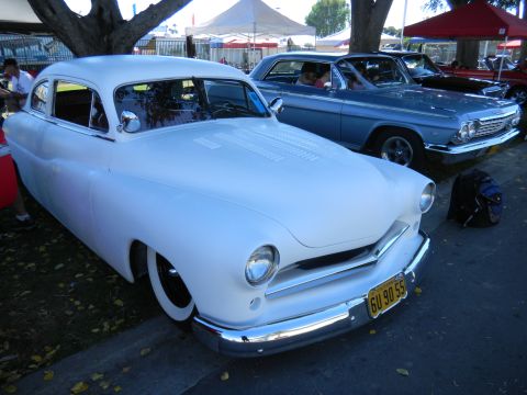 1997 Ford Ranger - A classic white coupe with whitewall tires is displayed at an outdoor event.