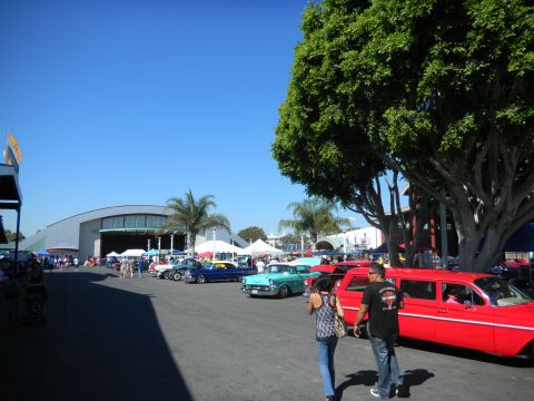 1997 Ford Ranger - A variety of vintage automobiles are on display at an outdoor gathering, with people milling around.