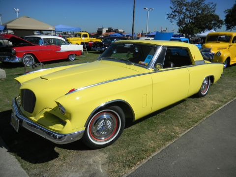 1997 Ford Ranger - Yellow coupe with chrome accents and distinctive grille at a car show.