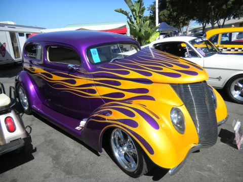 1997 Ford Ranger - Custom hot rod with flame paint job at a car show.