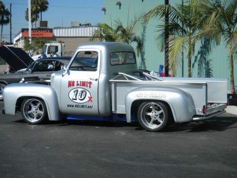1997 Ford Ranger - A custom silver pickup truck is parked outdoors, with another car visible in the background.