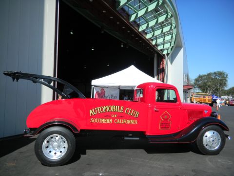 1997 Ford Ranger - A vintage red tow truck is parked outside a building, with "Automobile Club of Southern California" written on its side.