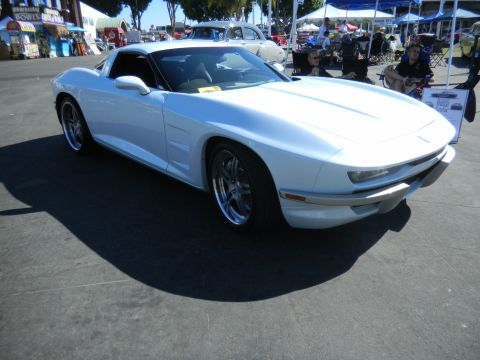 1997 Ford Ranger - White custom sports car with chrome wheels parked outdoors at an event.