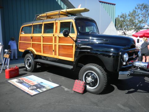 1997 Ford Ranger - This vintage International Harvester woodie wagon is displayed with a surfboard on its roof rack.