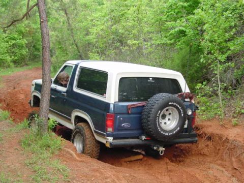 1986 Ford Bronco - This 1986 Ford Bronco navigates a challenging off-road trail, its capabilities.