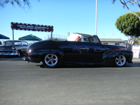 1997 Ford Ranger - A custom black convertible with flame graphics is parked outside the Costa Mesa Speedway.