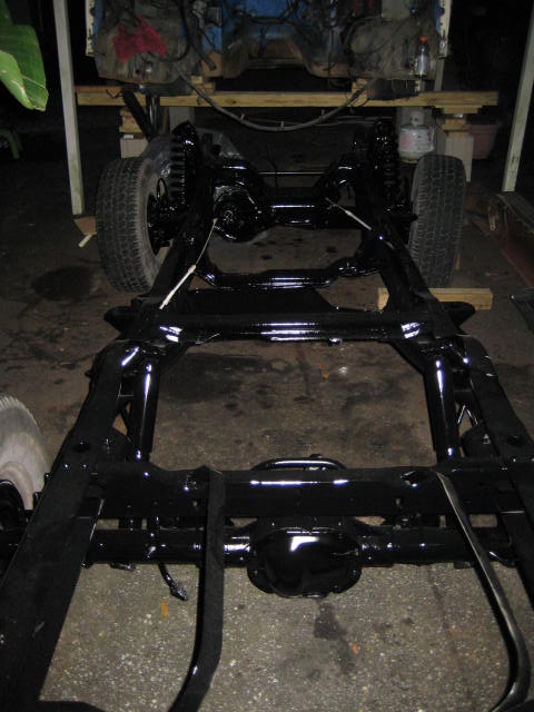 1988 Ford Bronco - Vehicle frame and drivetrain components are painted black, possibly during restoration or repair.