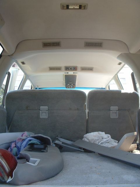 1994 GMC Suburban - Rear interior view of a 1994 GMC Suburban, focusing on the seats and overhead console.