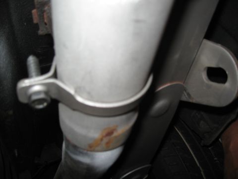 1968 Shelby GT500 - Close-up view of an exhaust pipe clamp, showing signs of rust.