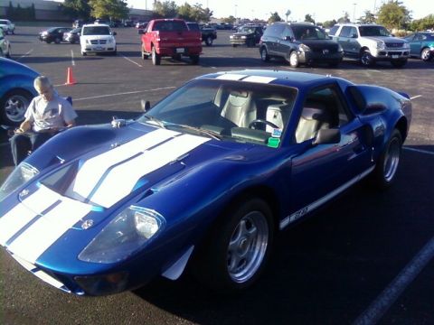 2000 Harley-Davidson FXDWGI Wide Glide - Blue Ford GT40 replica with white stripes in a parking lot.