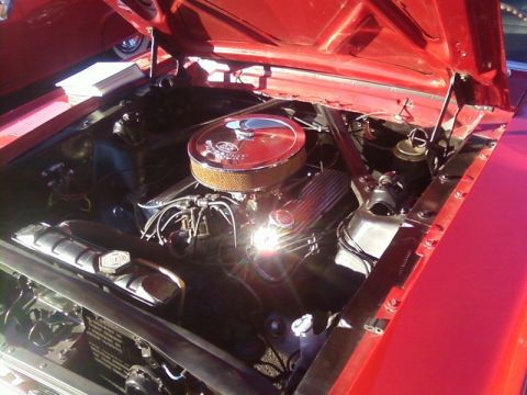 2000 Harley-Davidson FXDWGI Wide Glide - The engine bay of a red vehicle, a chrome air cleaner and V8 engine components.