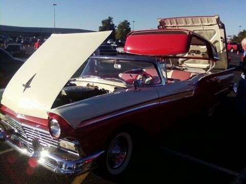 2000 Harley-Davidson FXDWGI Wide Glide - Two-tone red and cream 1957 Ford Fairlane convertible at a car show.