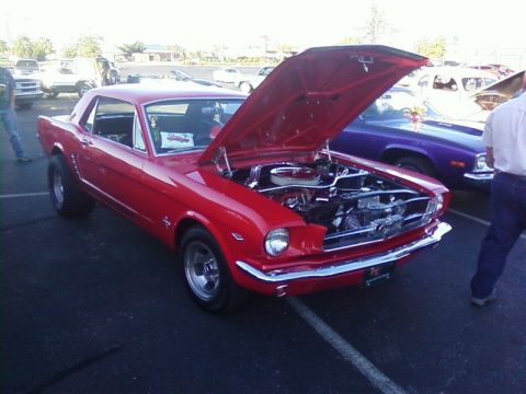 2000 Harley-Davidson FXDWGI Wide Glide - Classic red Ford Mustang at a car show, hood raised to display the engine.