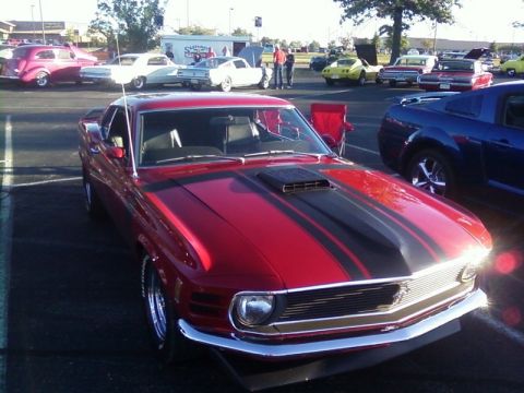 2000 Harley-Davidson FXDWGI Wide Glide - A red 1970 Ford Mustang Mach 1 is parked at a car show with other vehicles.