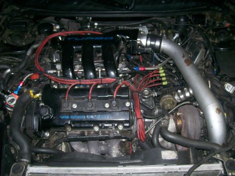 1995 Ford Probe - Engine bay with V6 DOHC 24 valve engine and turbocharger modifications visible.