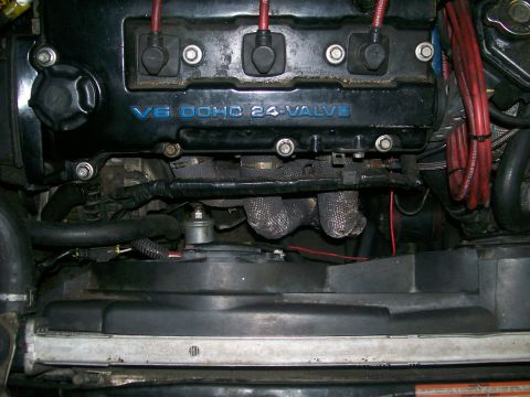 1995 Ford Probe - Close-up view of a V6 DOHC 24-VALVE engine, showing various components and wiring.