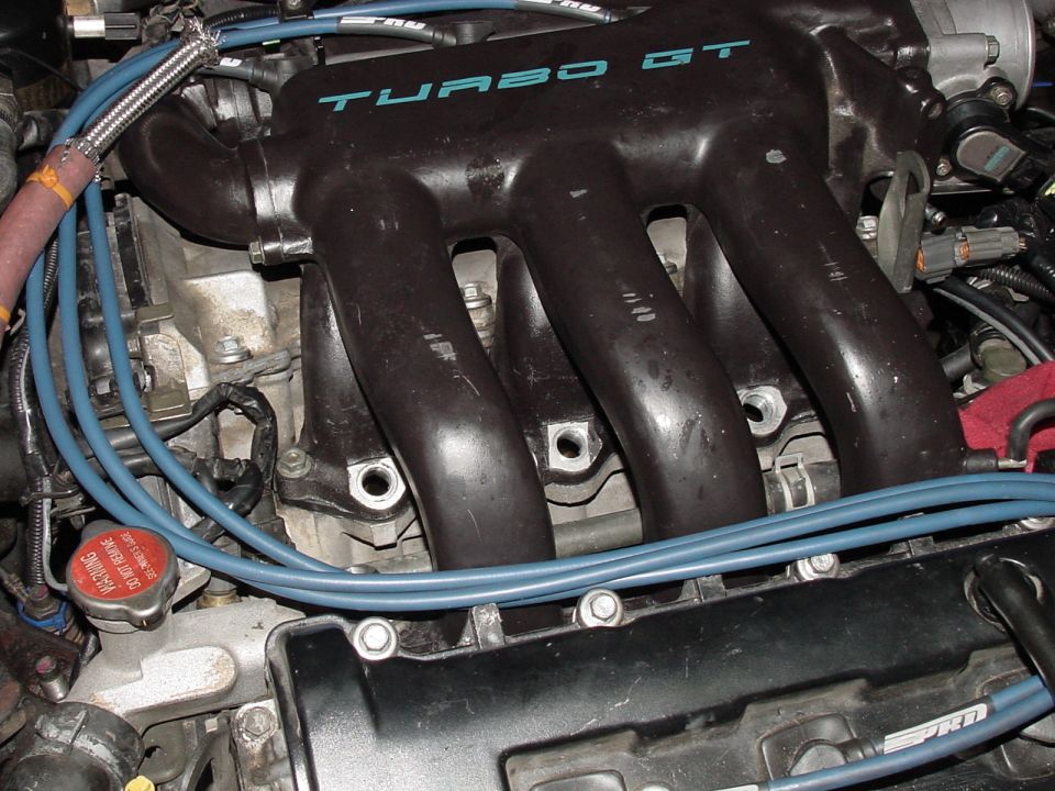 Black intake manifold with "TURBO GT" text