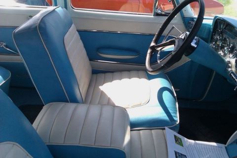 1991 Ford Crown Victoria - Interior view of a vintage automobile with distinctive blue and white upholstery and dashboard details.
