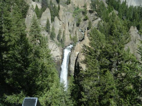 1981 Ford E350 - A scenic view of a waterfall in a mountainous, forested area.