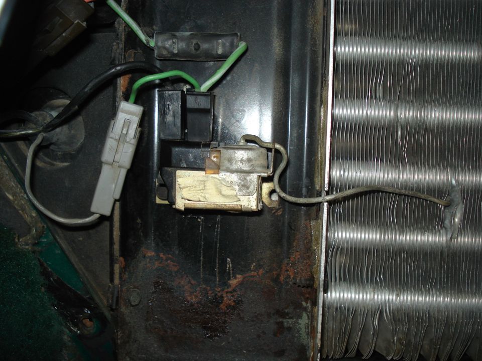 Close-up of a relay switch and wiring connected to a condenser unit