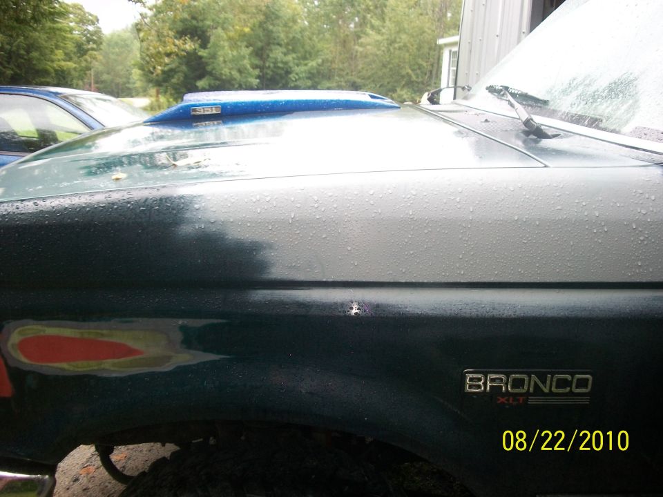 1993 Ford Bronco fender and hood with aftermarket scoop, showing body repair work on fender