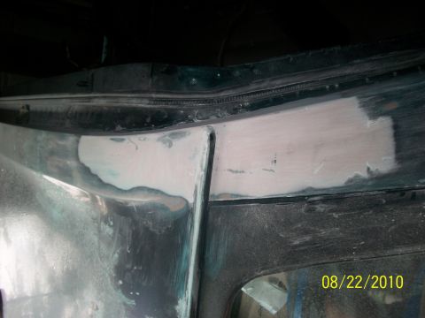 1993 Ford Bronco - Bodywork is underway on the vehicle's door frame, with filler applied to damaged areas.