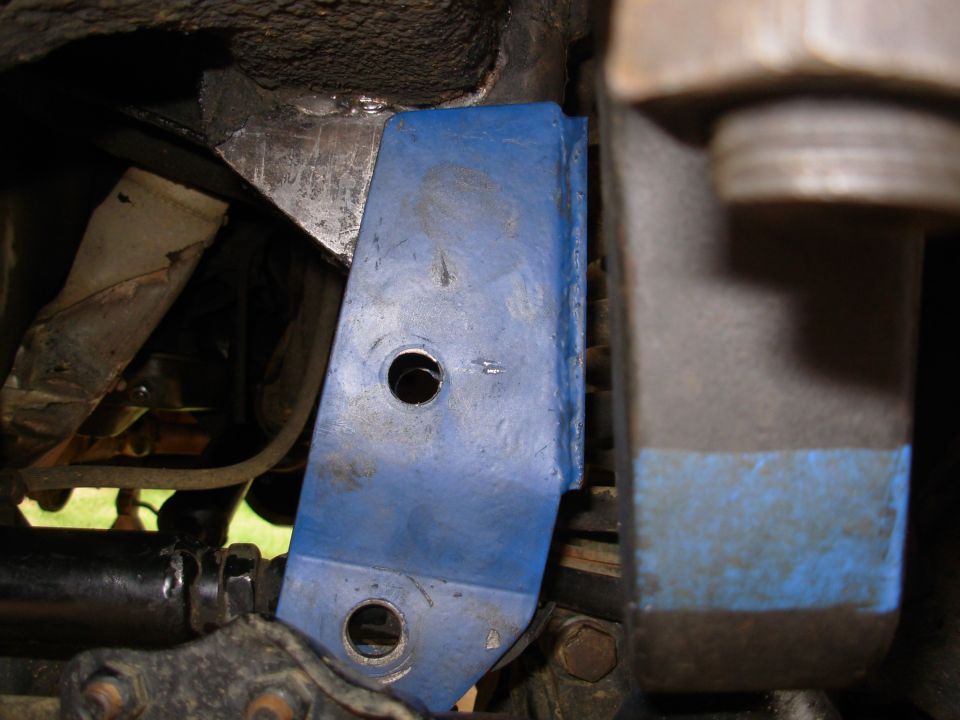 Since it doesn't lie flat with the bolt in, I removed it to see how far away it is from the track bar eye when it's flat against the frame bracket.  THIS FAR.