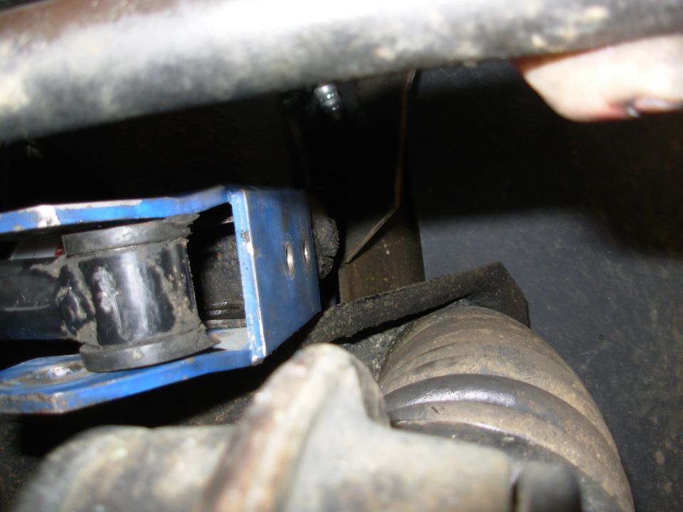 Since it doesn't lie flat with the bolt in, I removed it to see how far away it is from the track bar eye when it's flat against the frame bracket.  THIS FAR.