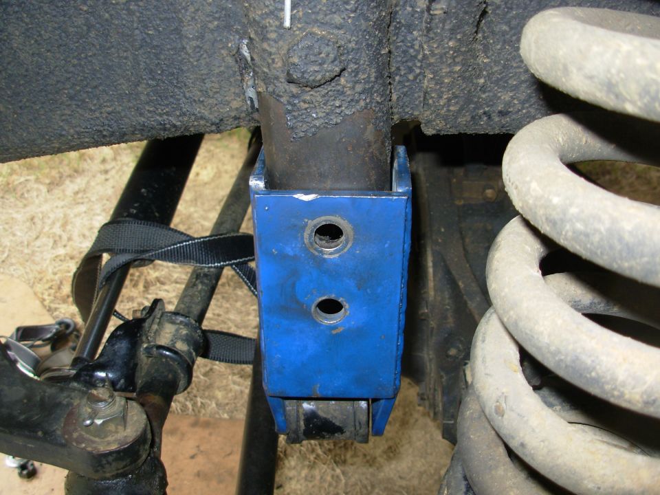 So here it is flat against the frame AND pushed down until the upper hole is aligned with the one in the frame bracket.
