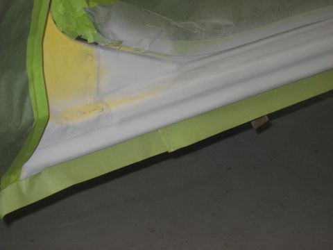 1978 Ford Bronco - Masking tape is applied to the edge of a car door, likely in preparation for painting.