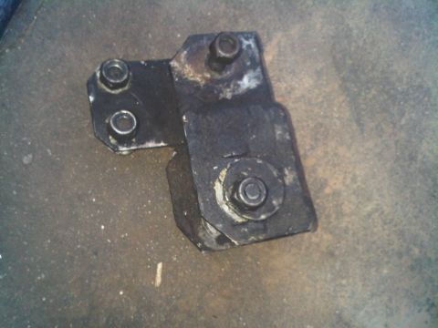 1986 Ford Bronco - This is a metal bracket with bolts, likely a vehicle part, but not a 1986 Ford Bronco.